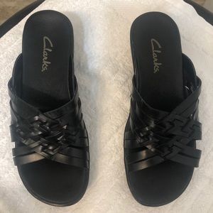 Clark’s black leather woven sandals
